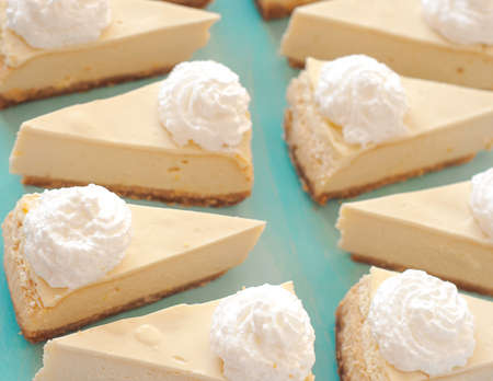 cheesecake pattern, servings of cheesecake on a blue background top viewの写真素材