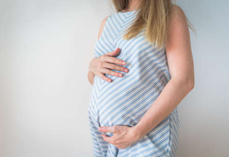 pregnant woman belly, reproductive technology, hope, new life conceptの写真素材