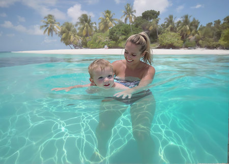 Mother and son swimming in a tropical pool at Maldives in summerの素材