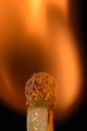 Close up of a burning match