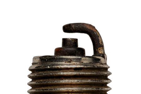 Extreme magnification - Used spark plug isolated on whiteの写真素材