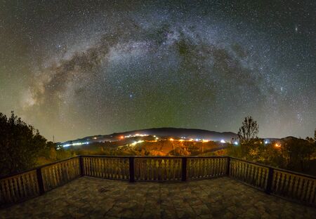 Milky way over the Pestera village in Piatra Craiului mountains from Romaniaの素材 [FY310147048249]