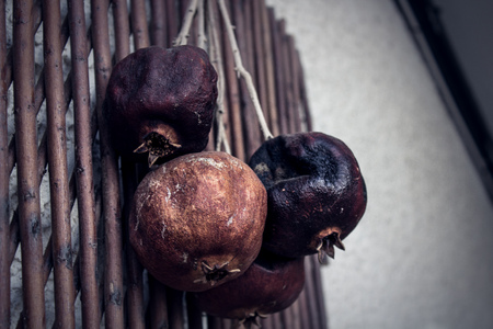 rotten fruits hanging on the wallの写真素材