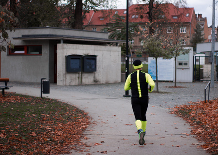 runner running at an autumn scenery park  at a beautiful morning aloneの写真素材