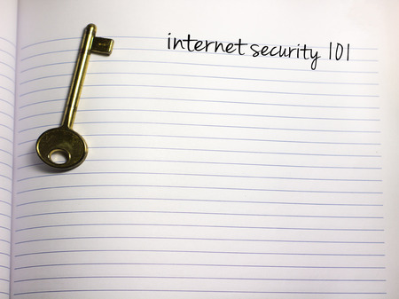 notebook with a key and the text internet security and plenty of copy space belowの写真素材