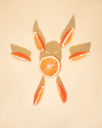 Sliced orange slices with abstract shadow. Devil theme.の写真素材