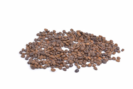 Roasted coffee beans pile from top on white backgroundの写真素材