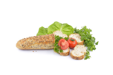 breakfast with fresh baked bread, traditonal salami, cheese and vegetablesの写真素材