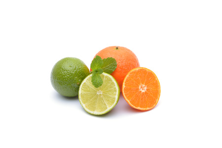 Limes and tangerines on white backgroundの写真素材