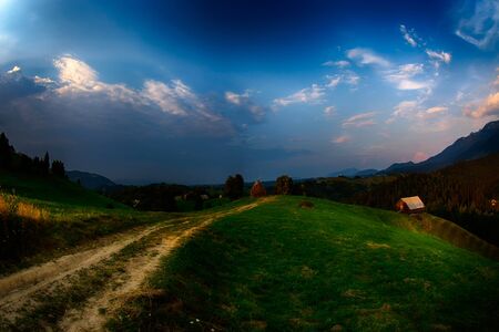 Evening, sunset on mountain hills of Simon village. Bran.の写真素材