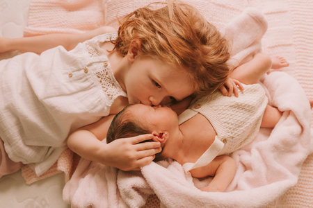 big sis taking care of her little sisterの写真素材