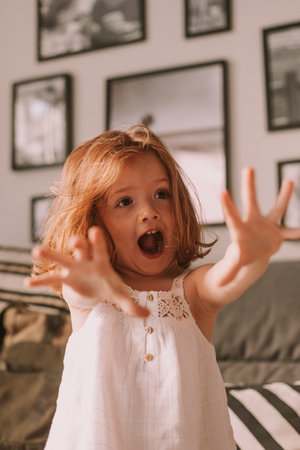 happy little girl goofing arroundの写真素材