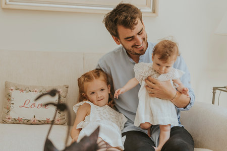 Lovely portrait of father and daughtersの写真素材