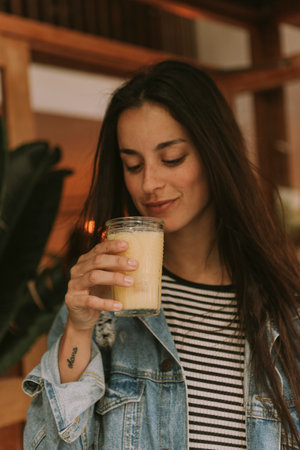 Woman enjoying a milkshakeの写真素材