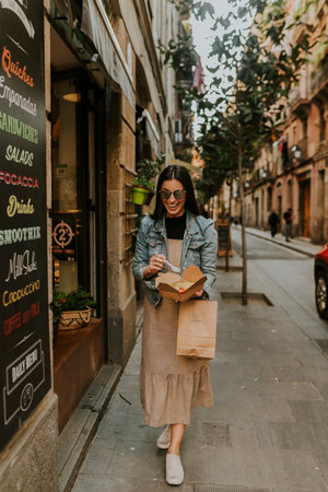 Woman laughing and cominedo in the cityの写真素材