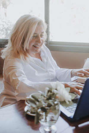 Businesswoman working on her laptop in an officeの写真素材