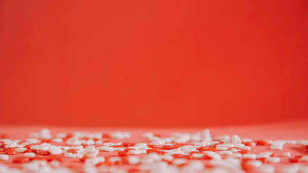 valentines red background with tiny little heartsの写真素材