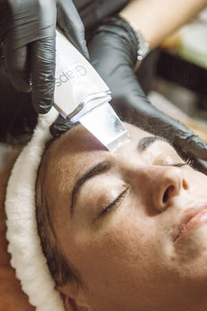 woman receiving a facial in a beauty salon