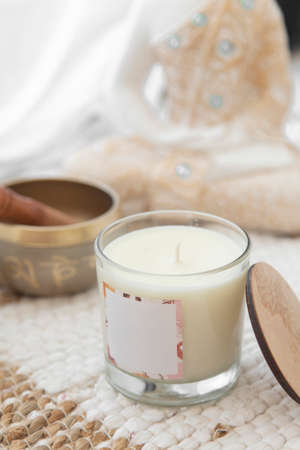 meditation space with candles and woman in backgroundの写真素材