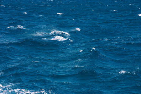 Waves with white horses on a surface of the seaの写真素材