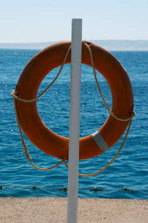Life Buoy Weighing on coast near the seaの写真素材
