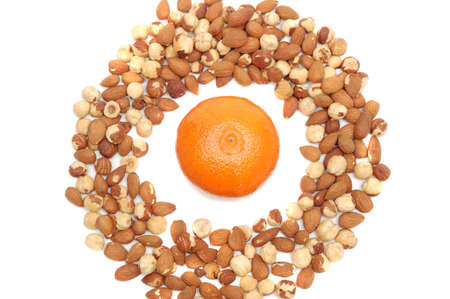 mandarin in center of nuts ringの写真素材