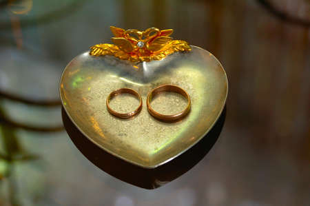 two wedding rings on silver plateの写真素材