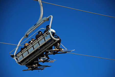 Chairlift transporting skiersの写真素材