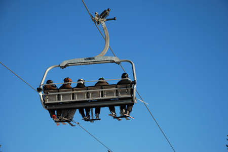 Chairlift transporting skiersの写真素材