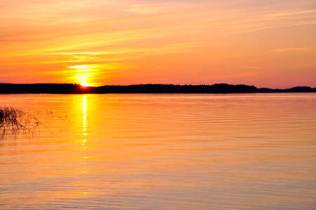 Midnight sun in the north of Swedenの写真素材