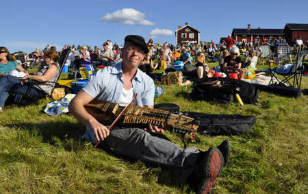 BINGSJO, SWEDEN - JULY 6: Fiddlers and accordion ensamble at Bingsjostamman music festival in Bingsjo, Sweden, July 6 2011, Bingsjo, Sweden.のeditorial素材