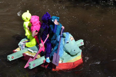 Uppsala, Sweden - 30 April: A participant in a funny boat racein action at Uppsala, Sweden April 30, 2009のeditorial素材