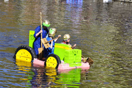 Uppsala, Sweden - 30 April: A participant in a funny boat racein action at Uppsala, Sweden April 30,...