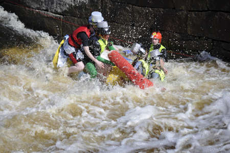Uppsala, Sweden - 30 April: A participant in a funny boat race in action at Uppsala, Sweden April 30, 2012のeditorial素材