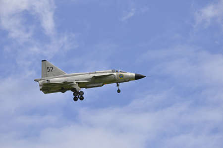 Dala - Jarna, Sweden - 11 August: Scandinavian airshow with Viggen AJS 37 F at Dala - Jarna, Sweden August 11, 2012gのeditorial素材