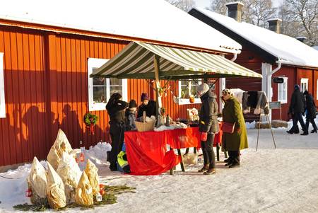 Satra - brunn, Sweden - December 09: The traditional Christmas market in Satra - Brunn, people look for a Christmas gift on December 09, 2012 in Satra - Brunn, Sweden.のeditorial素材