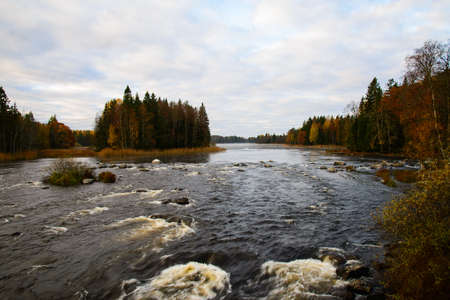 Scenic view of river in autumn at sunriseの写真素材