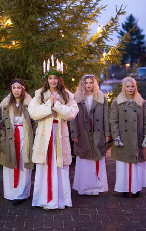 Heby, Sweden - December 13: Portrait of Santa Lucia at Christmas celebration in Heby on December 13, 2014 in Heby Sweden.のeditorial素材