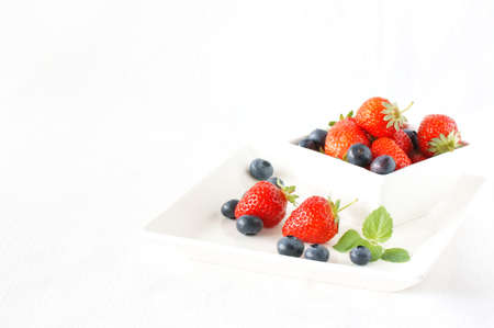 strawberry with blueberry in the white bowl                      