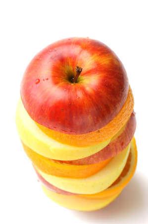 stacked up many sliced fruits on the white backgroundの写真素材