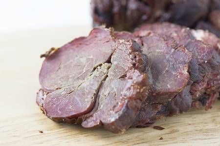 Smoked Venison on the cutting boardの写真素材