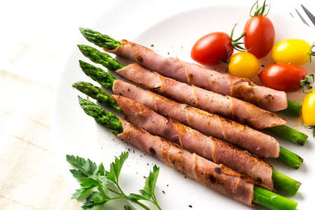 Green asparagus wrapped in Baconの写真素材
