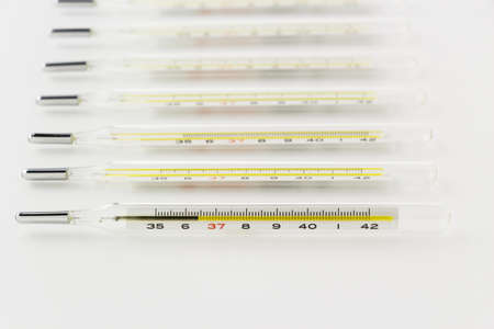 many mercury clinical thermometers  on the white backgroundの写真素材