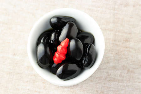 Black soybeans with red pickled chinese artichokeの写真素材