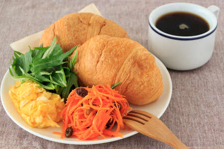 Bread and coffee with salad for Breakfast