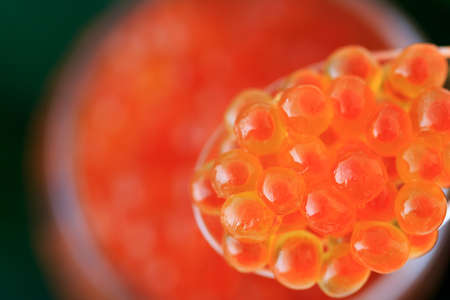 red caviar on the spoon