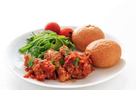 chicken  ragu with tomato sauce on the white backgroundの写真素材