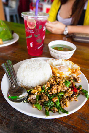 Fried basil leave with chicken on rice の写真素材