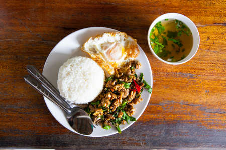 Fried basil leave with chicken on rice の写真素材