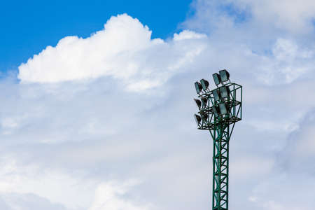 Spot-light tower for sport game with beautiful blue skyの写真素材